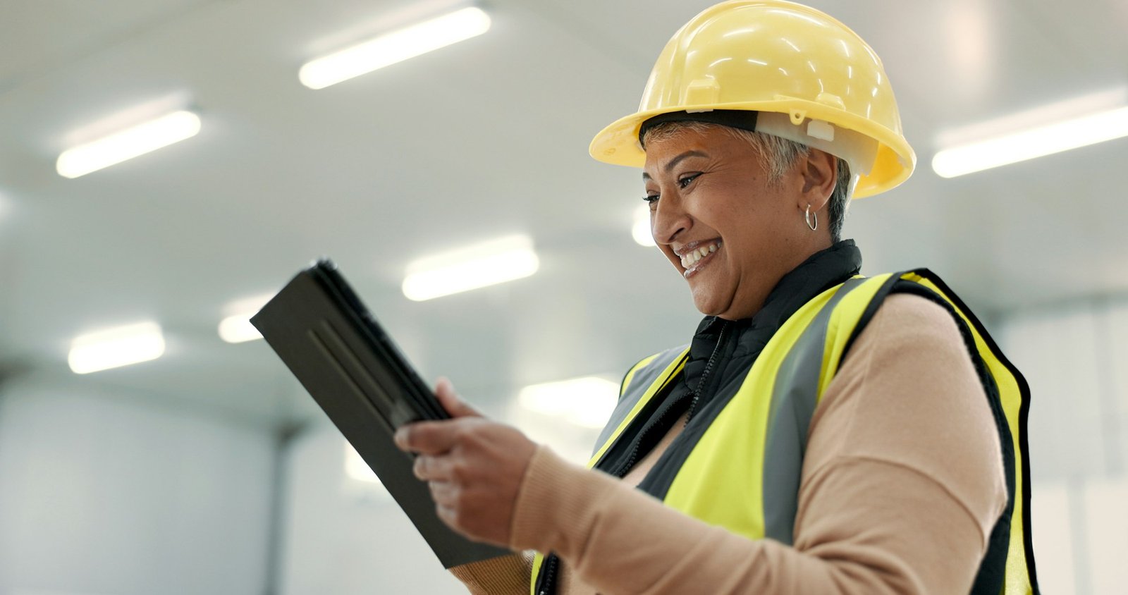 Engineering, woman and tablet at construction site inspection, building development and industrial