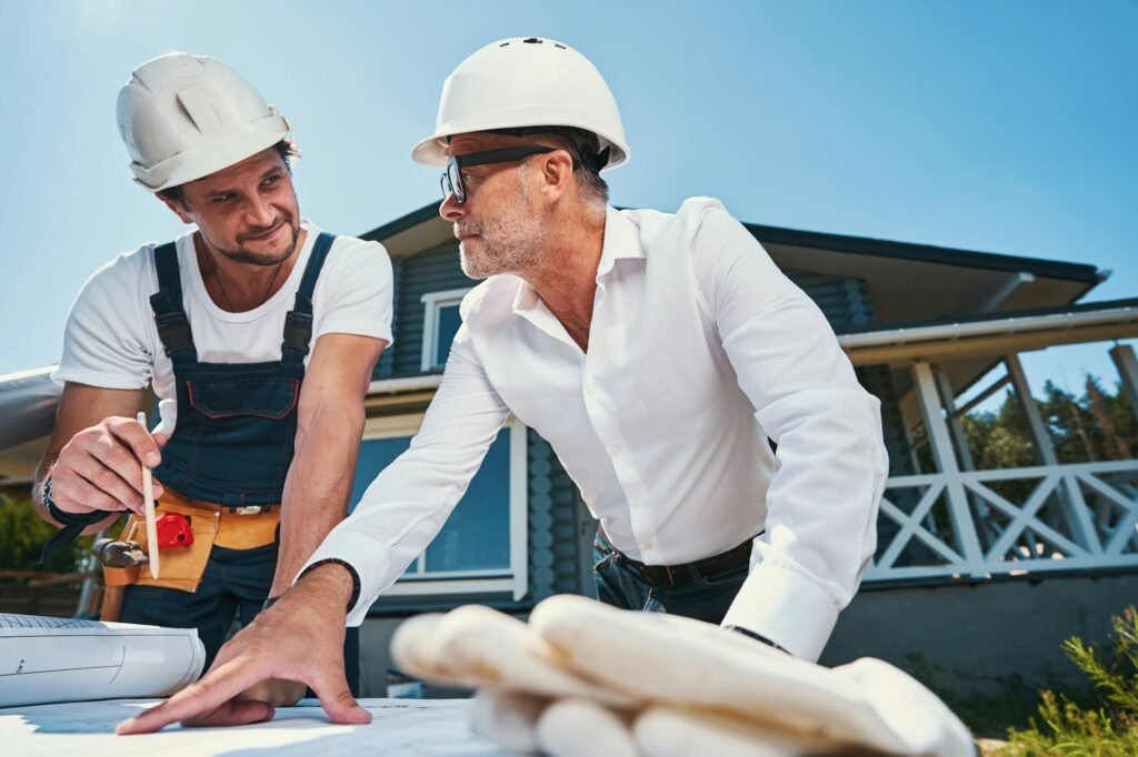 Mature engineer is consulting with younger colleague