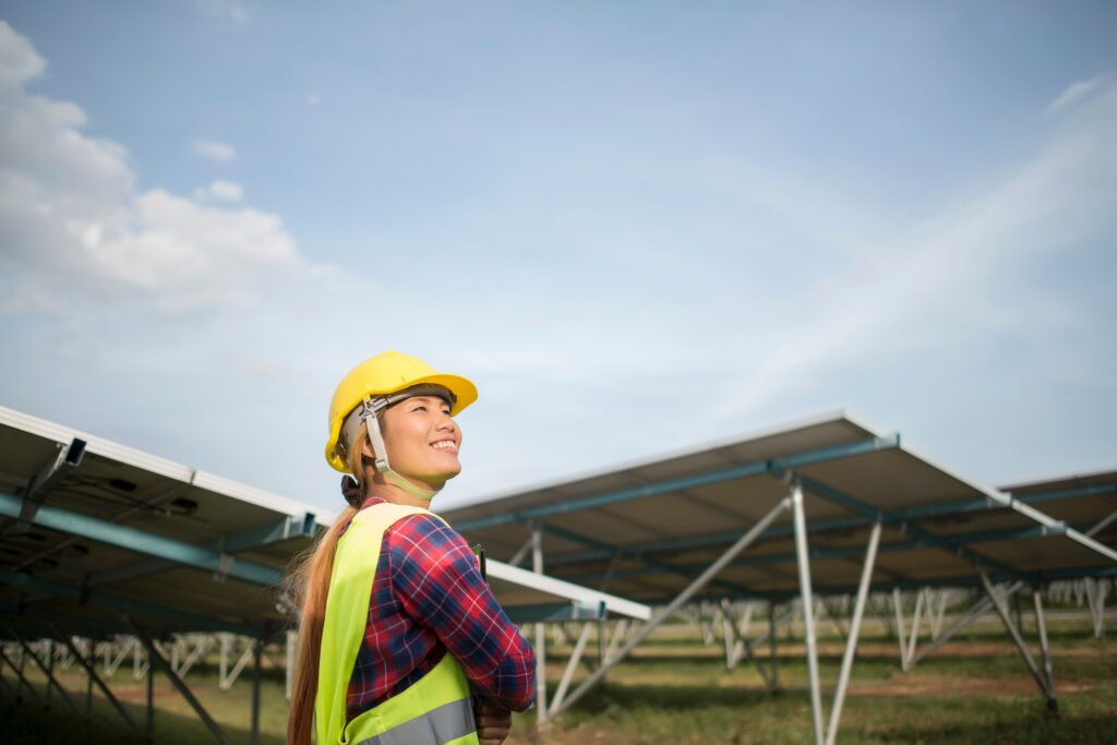 Engineer electric woman checking and maintenance of solar cells.