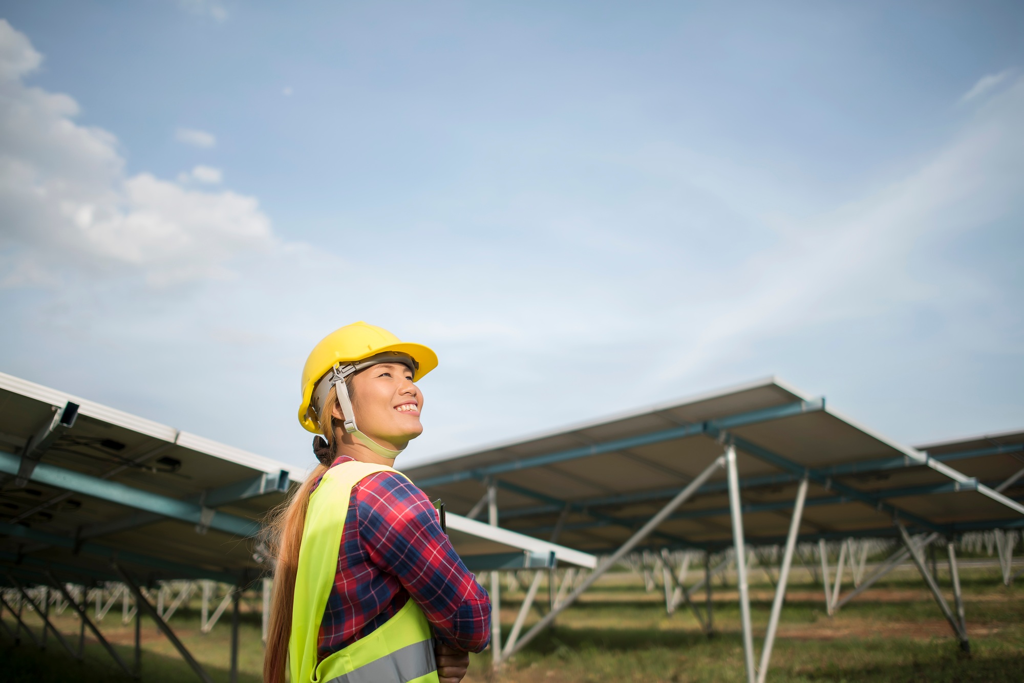 Engineer electric woman checking and maintenance of solar cells.
